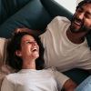 A couple relaxing and laughing at home